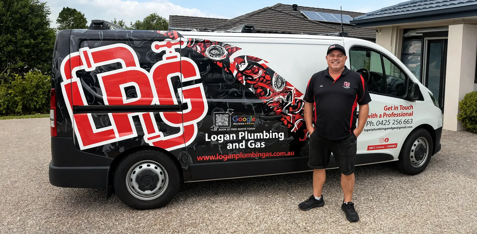 Logan Plumbing & Gas plumber standing beside the branded service van